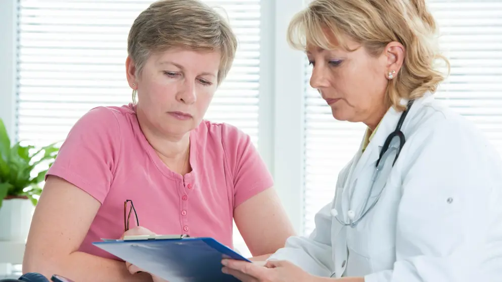 Female patient discussing treatment plans with female doctor