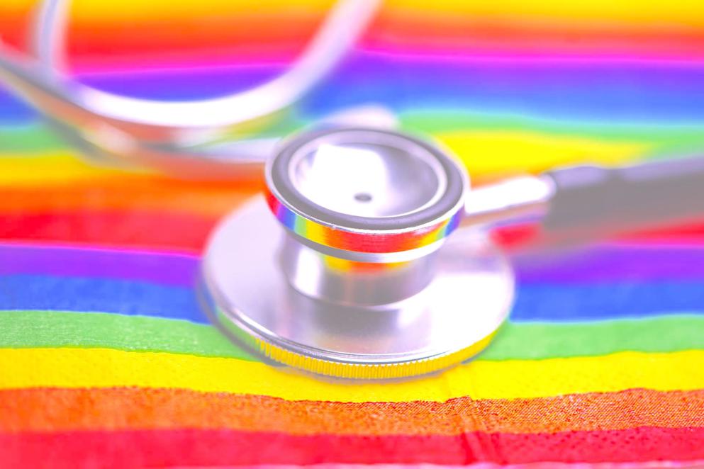 Black stethoscope on LGBT flag background