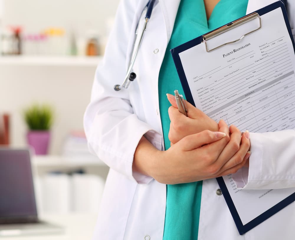 Doctor holding clipboard