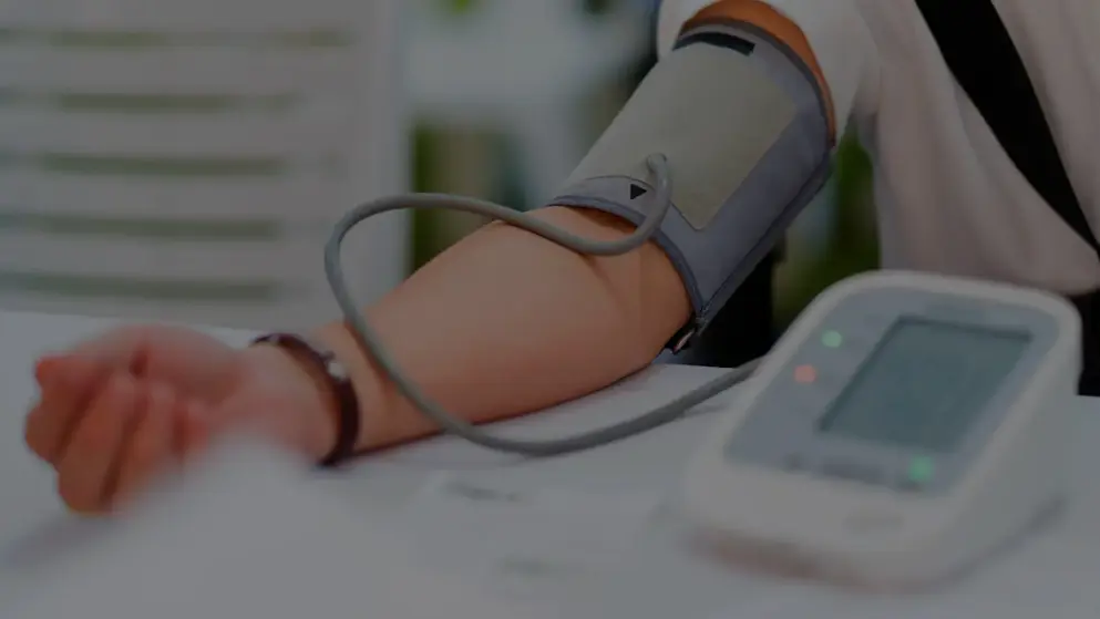 An arm with a blood pressure gauge attached; testing for high blood pressure